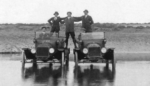 five men and two cars